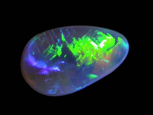 Ópalo cristal negro tipo gelatina en verde, azul y amarillo – forma libre