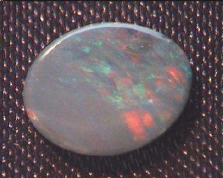 Australian Oval Opal Doublet in Green, Blue and Red