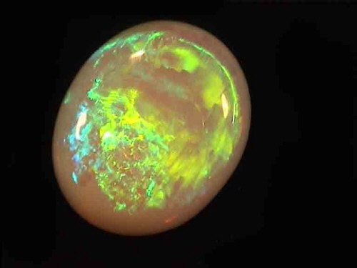 Opale di cristallo australiano ovale verde-giallo da Coober Pedy