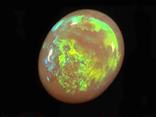 Opale di cristallo australiano ovale verde-giallo da Coober Pedy
