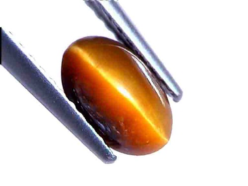 Ojo de tigre australiano, cabujón ovalado dorado/miel
