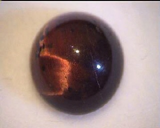 Ojo de tigre australiano, cabujón redondo naranja y marrón