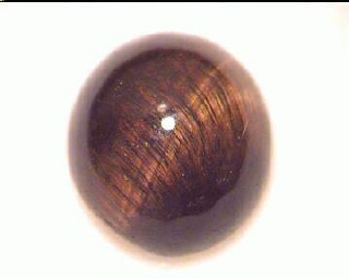 Ojo de tigre australiano, cabujón redondo naranja y marrón