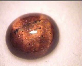Ojo de tigre australiano – Cabujón ovalado naranja y marrón