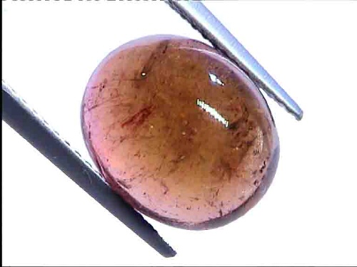 Cabochon ovale de tourmaline orange-brun du Brésil
